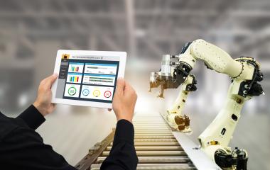 A man controlling the robot hand