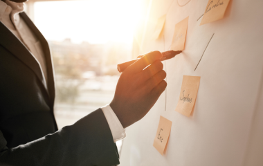 Man drawing on the flip chart