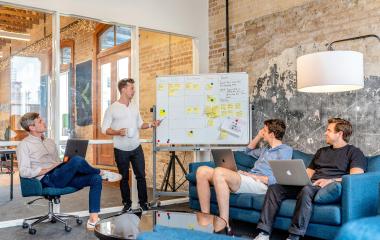 People in a room having a meeting