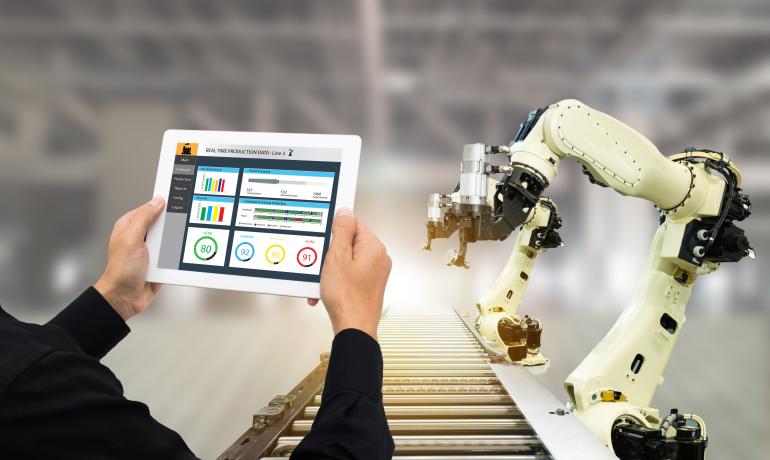 A man controlling the robot hand