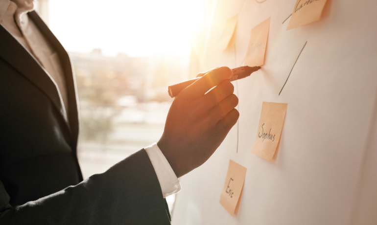Man drawing on the flip chart