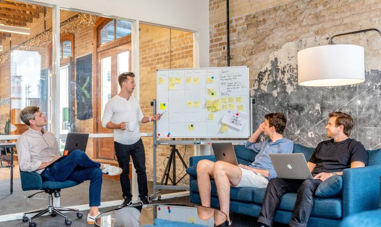 People in a room having a meeting